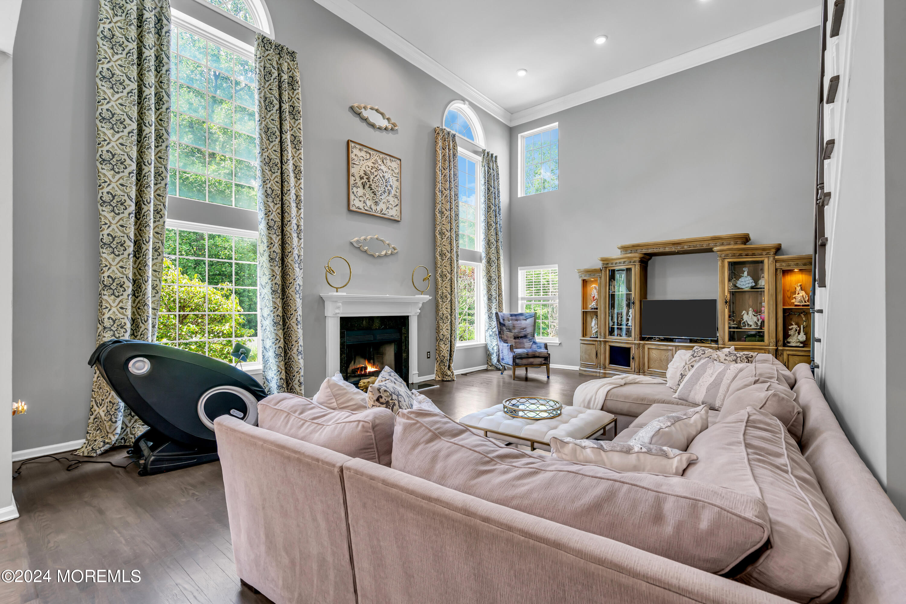 22 Cedar Knoll Road Jackson, NJ 08527 - Photo 30 of 76 a living room with furniture a fireplace and a large window