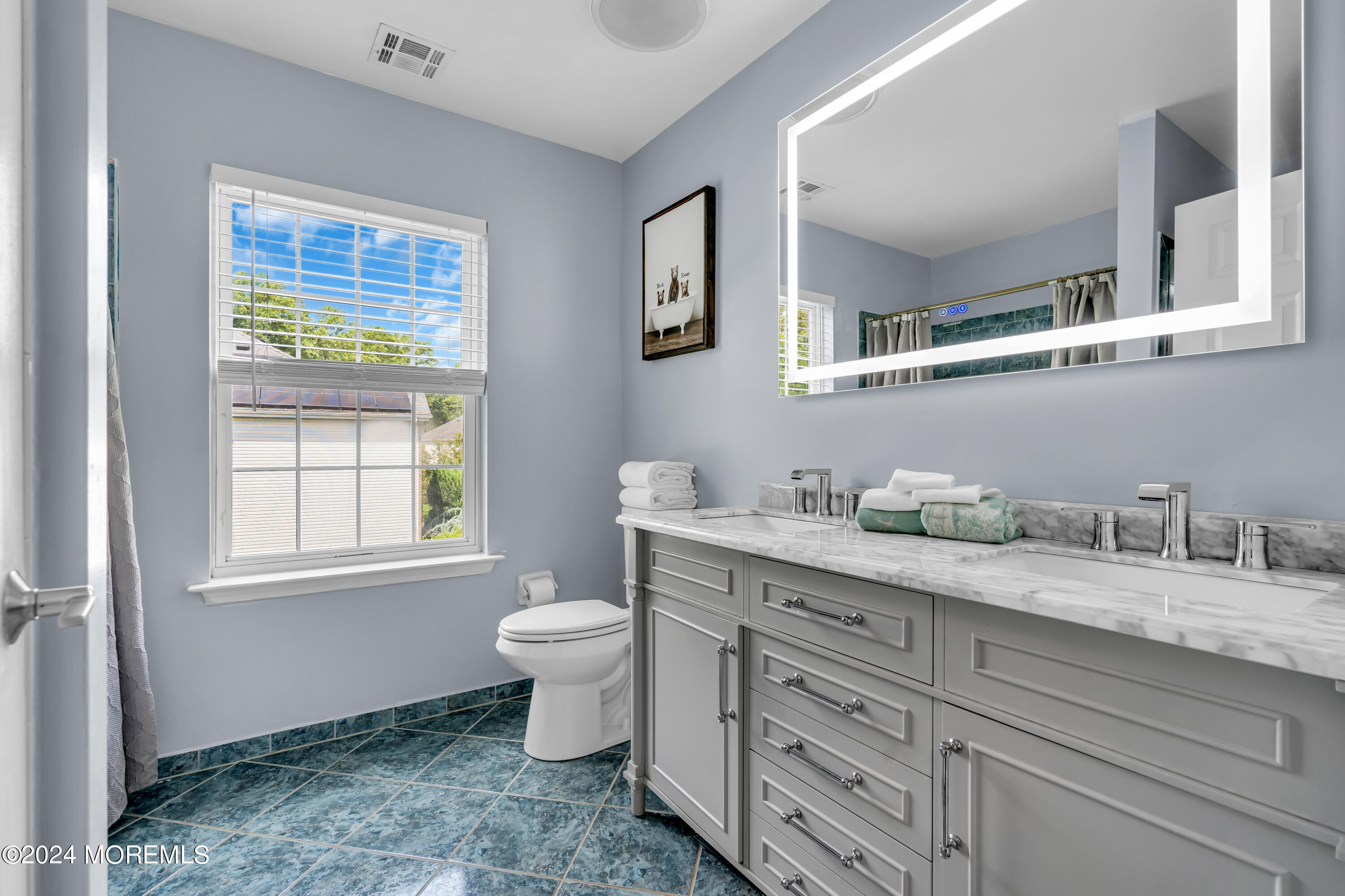 22 Cedar Knoll Road Jackson, NJ 08527 - Photo 49 of 76 a bathroom with a granite countertop toilet sink and mirror