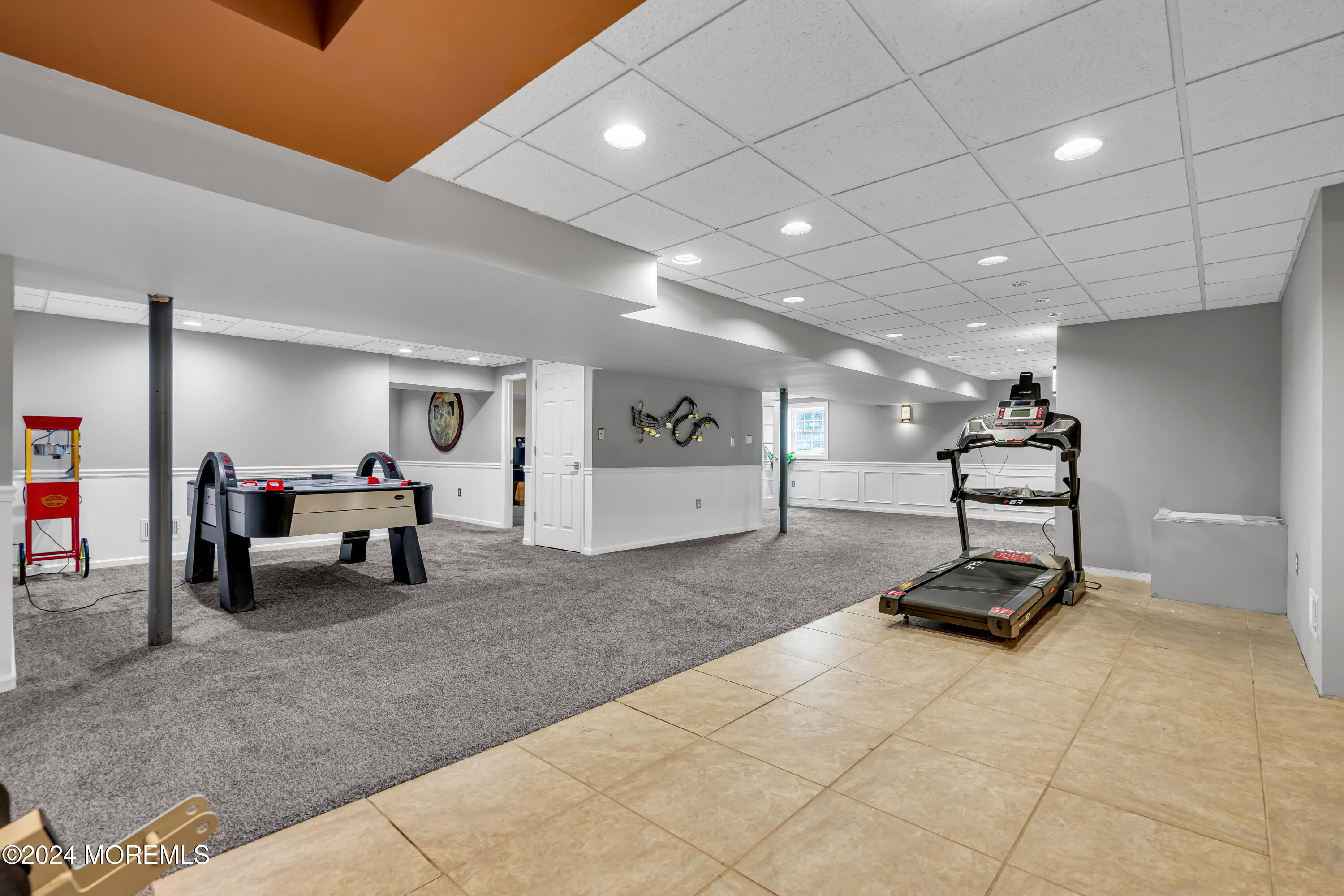 22 Cedar Knoll Road Jackson, NJ 08527 - Photo 55 of 76 a living room with furniture and a gym equipment