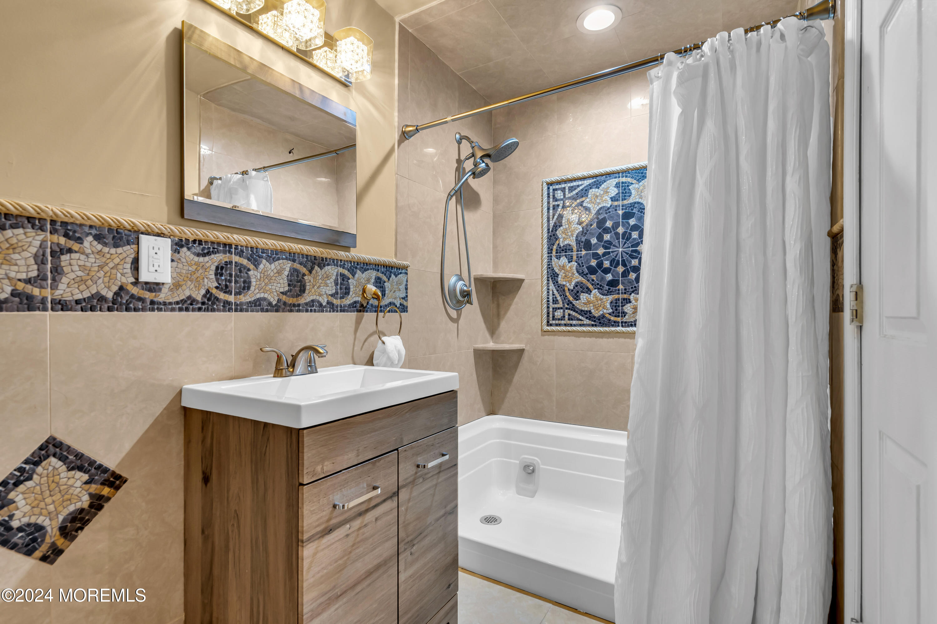 22 Cedar Knoll Road Jackson, NJ 08527 - Photo 59 of 76 a bathroom with a sink a mirror a vanity and a shower