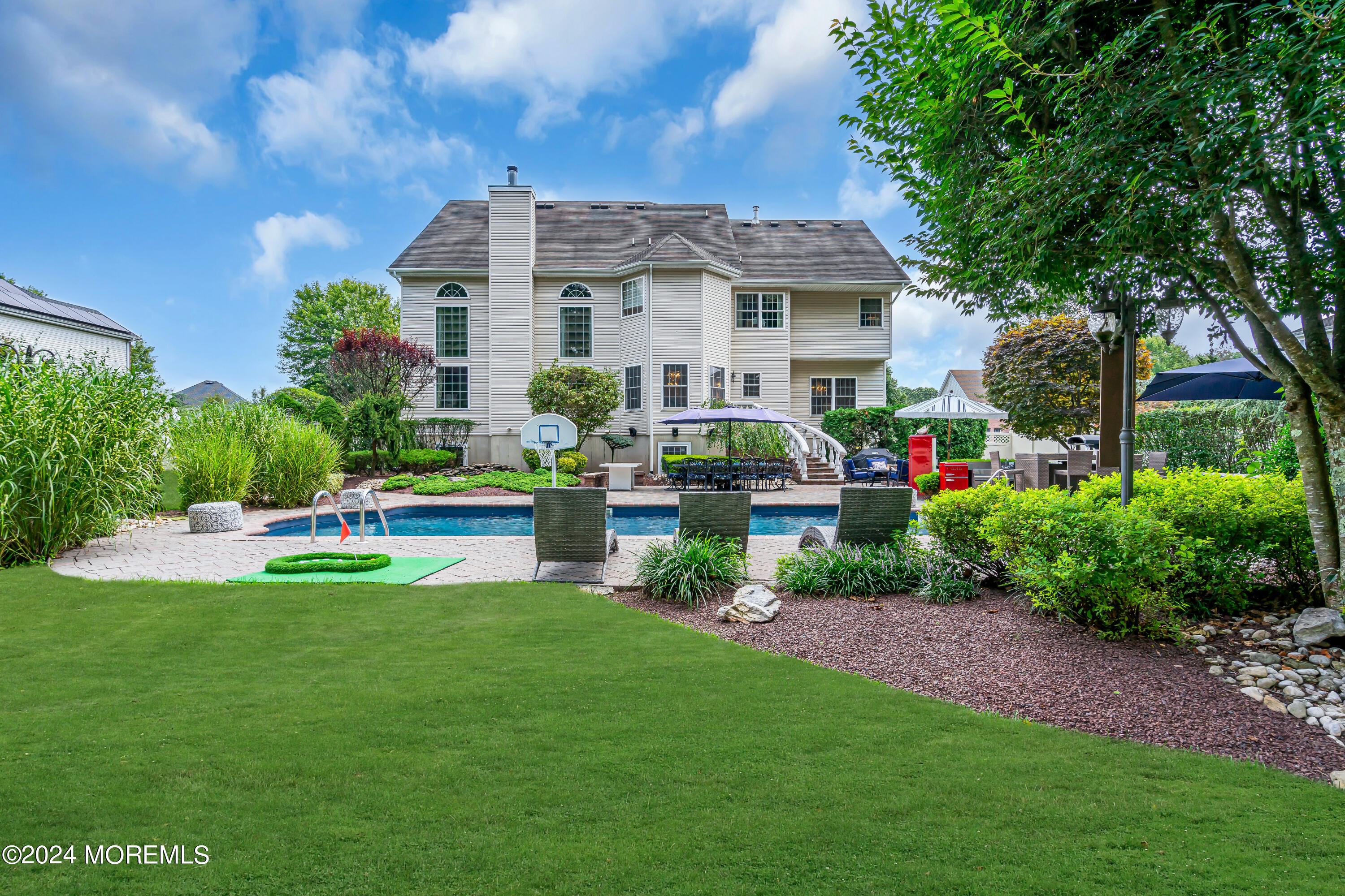 22 Cedar Knoll Road Jackson, NJ 08527 - Photo 60 of 76 a view of a house with a yard and sitting area