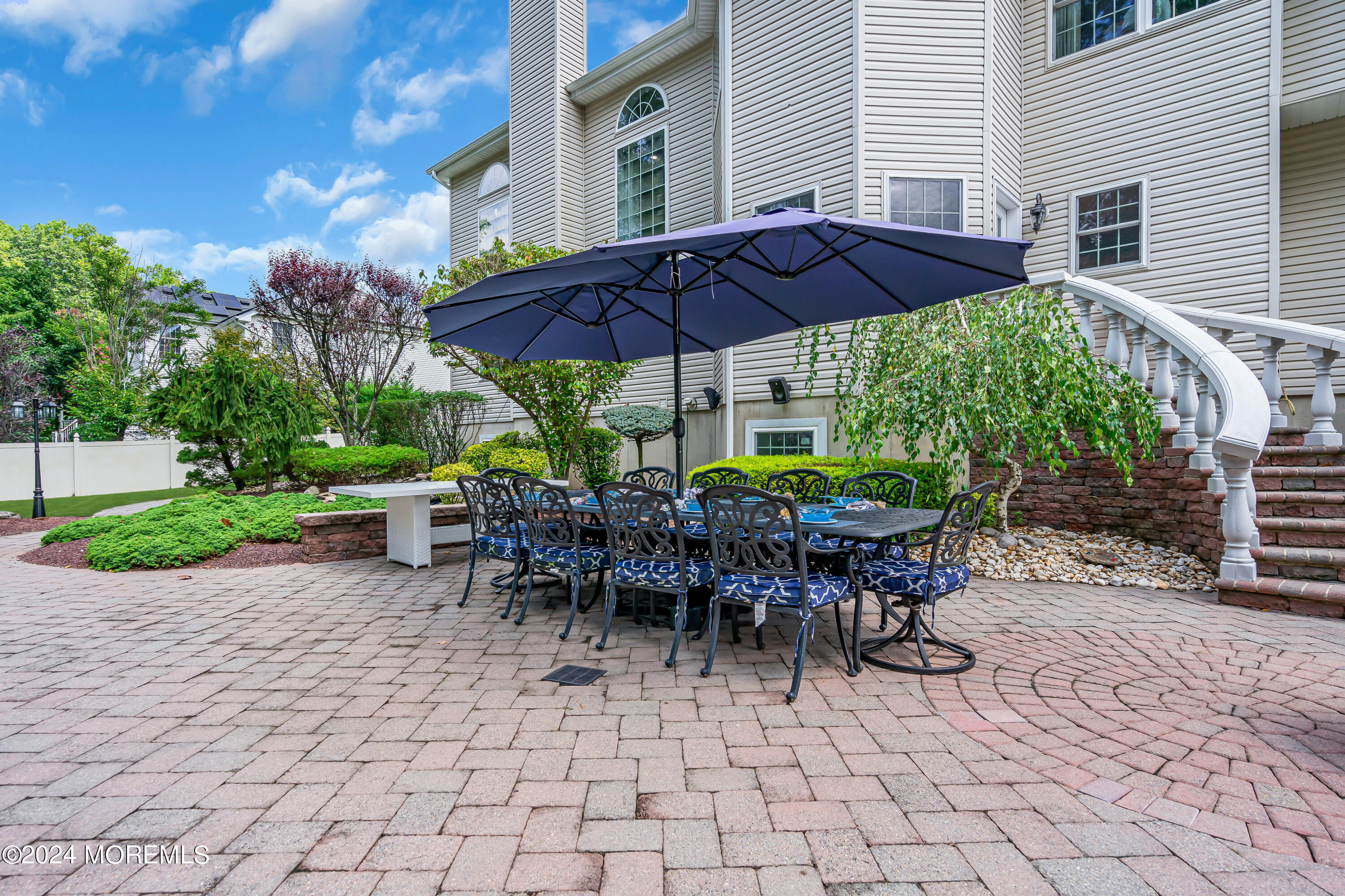 22 Cedar Knoll Road Jackson, NJ 08527 - Photo 62 of 76 a view of a patio with a table and chairs under an umbrella
