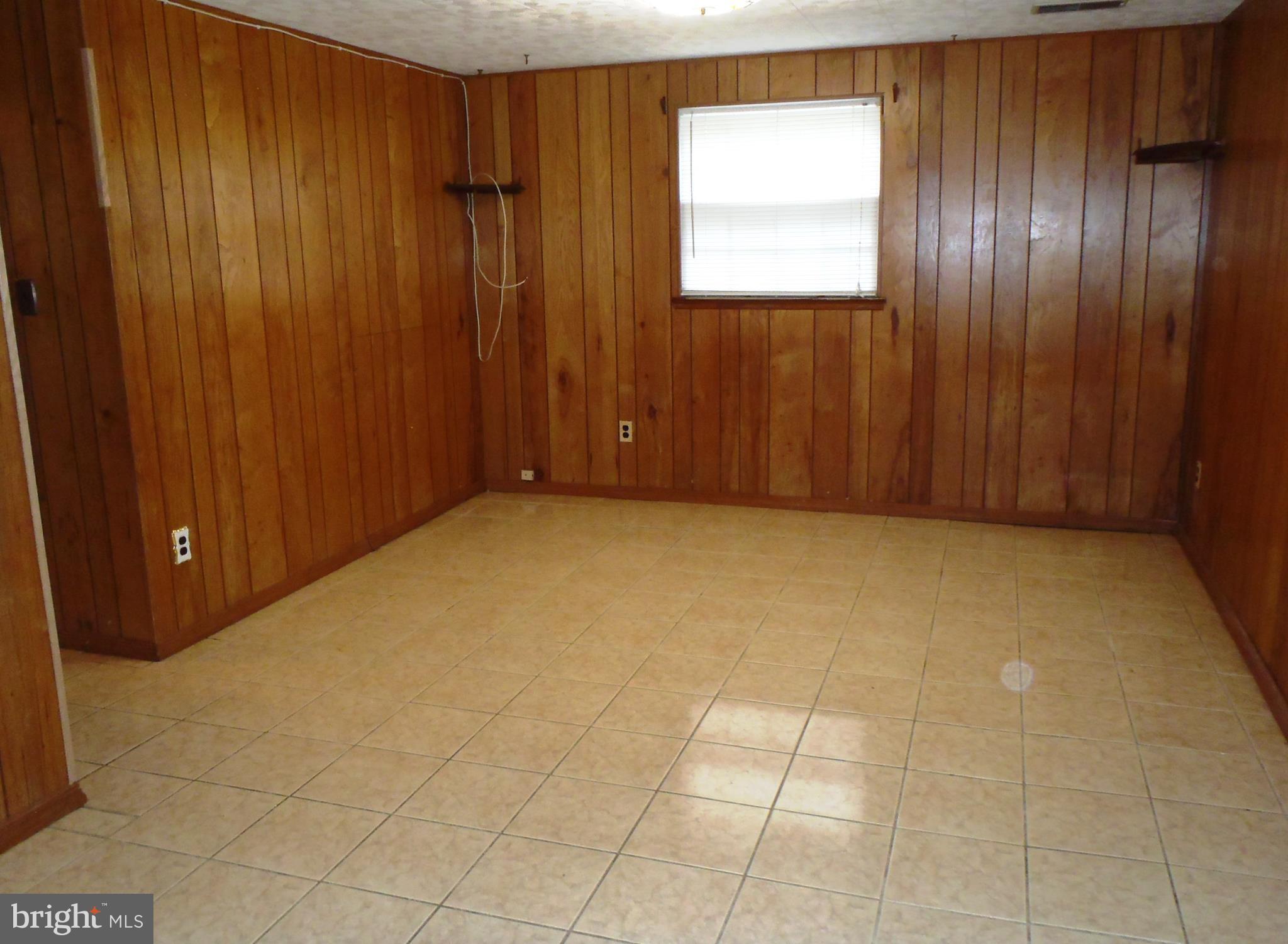 12003 Cook Court Silver Spring, MD 20902 - Photo 13 of 20 Family room. lower level, w/ ceramic tile floor.