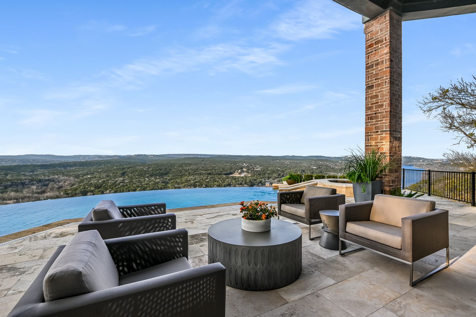 Infinity-edge pool and expansive view of Lake Austin and the hills of Austin.
