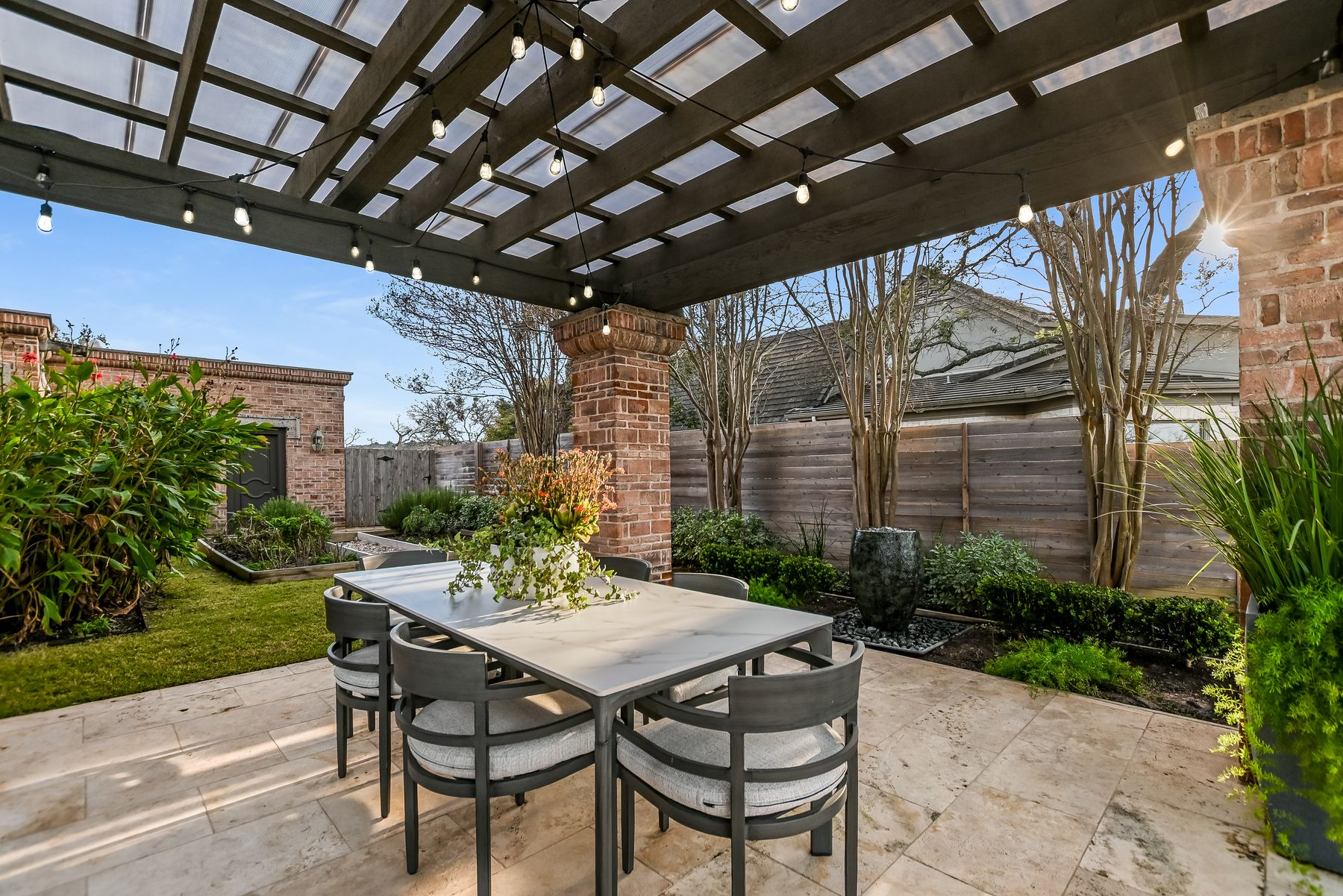 78 Pascal Lane Austin, TX 78746 - Photo 18 of 20 Garden and outdoor dining area overlooking the views of Lake Austin.