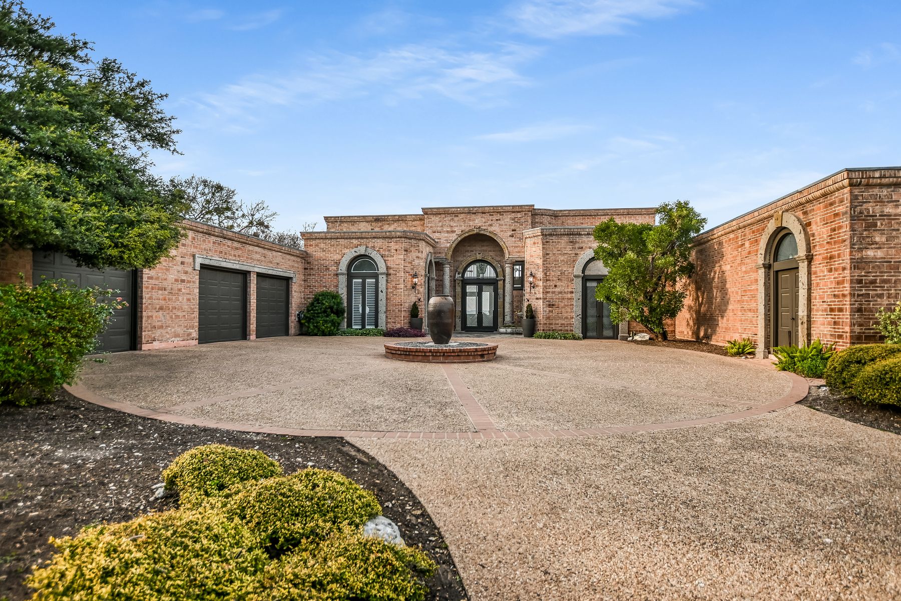 78 Pascal Lane Austin, TX 78746 - Photo 3 of 20 Circular driveway and 3-car garage