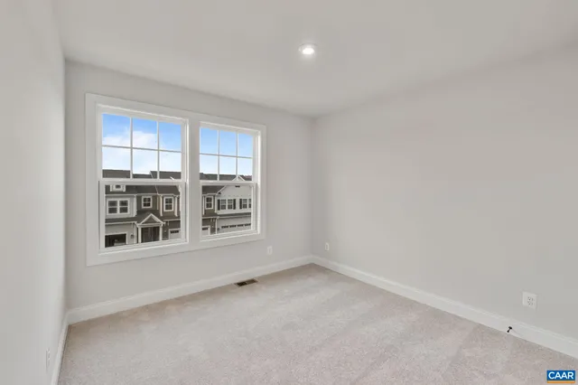 a front view of a building with a swimming pool