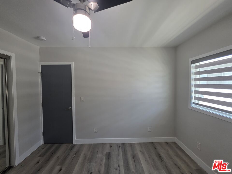 1505 South Cochran Avenue, Unit 4 Los Angeles, CA 90019 - Photo 11 of 45 wooden floor in an empty room