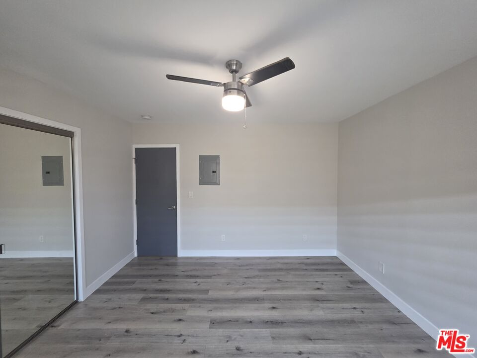 1505 South Cochran Avenue, Unit 4 Los Angeles, CA 90019 - Photo 19 of 45 wooden floor in an empty room