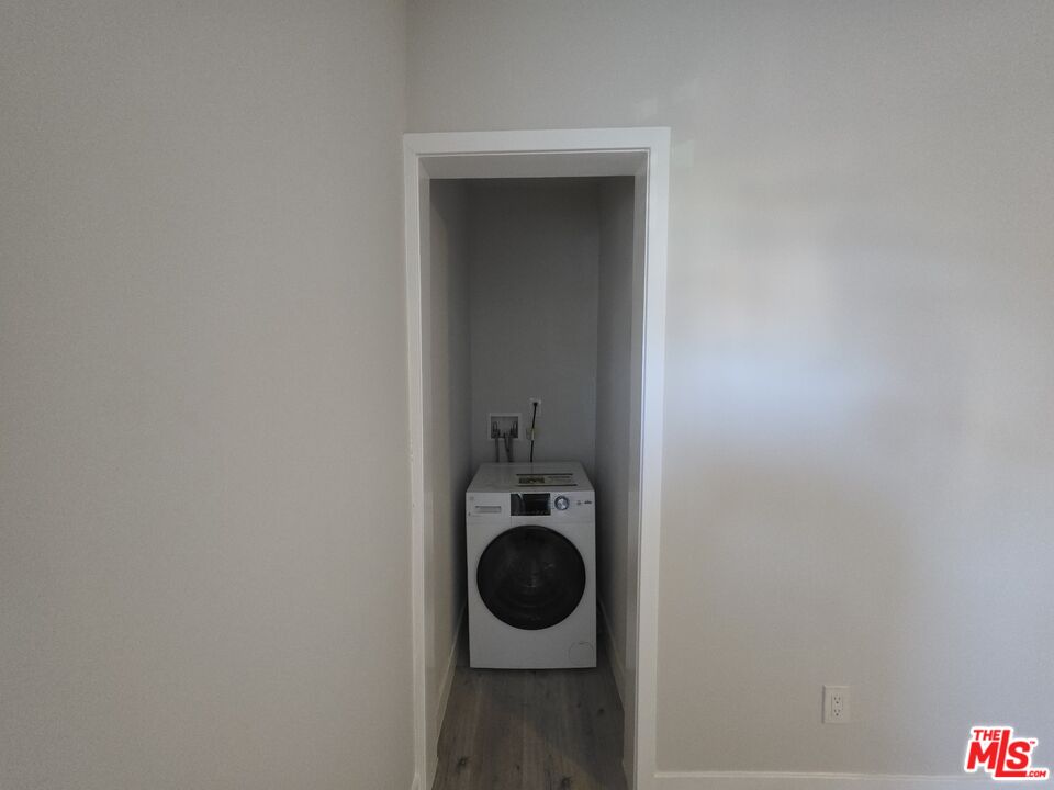 1505 South Cochran Avenue, Unit 4 Los Angeles, CA 90019 - Photo 32 of 45 a bathroom with a toilet and a vanity