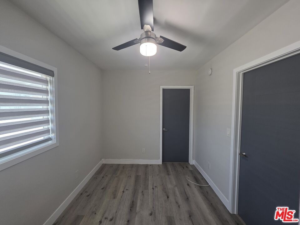 1505 South Cochran Avenue, Unit 4 Los Angeles, CA 90019 - Photo 42 of 45 a view of wooden floor and chandelier in a room