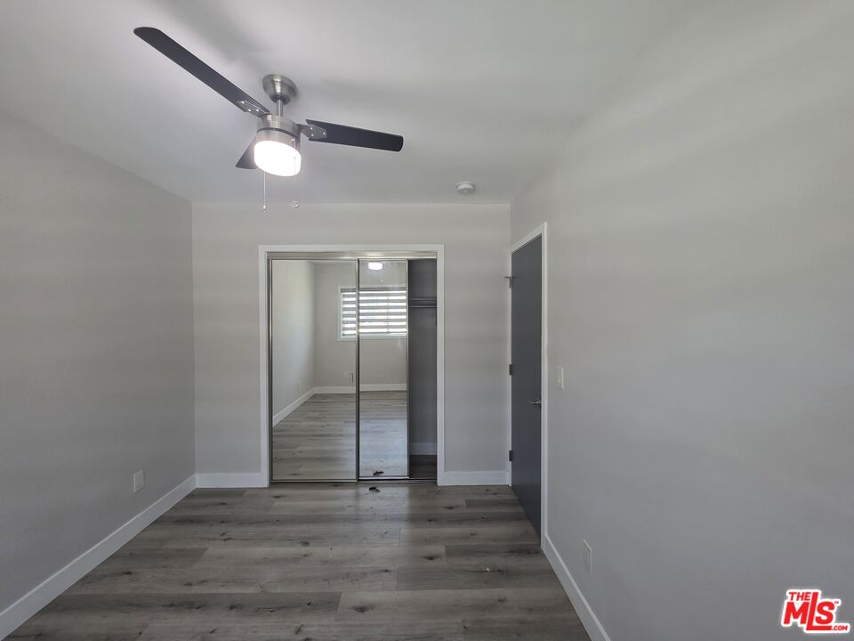 1505 South Cochran Avenue, Unit 4 Los Angeles, CA 90019 - Photo 9 of 45 a view of empty room with wooden floor