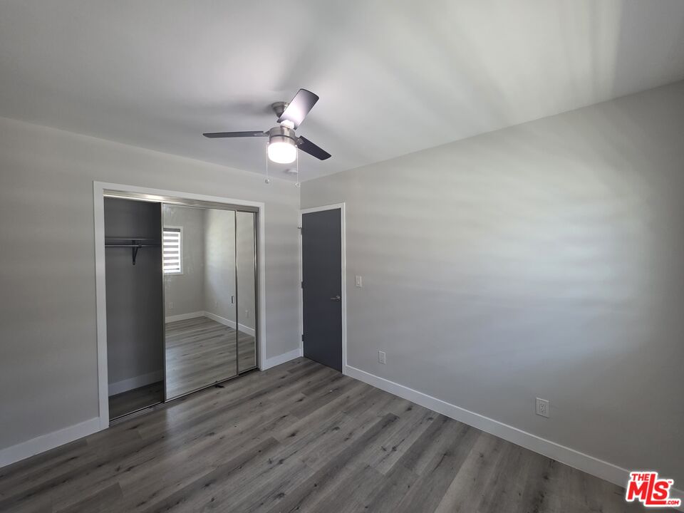 1505 South Cochran Avenue, Unit 4 Los Angeles, CA 90019 - Photo 10 of 45 wooden floor in an empty room