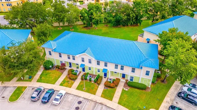 a view of an chairs and table in the backyard
