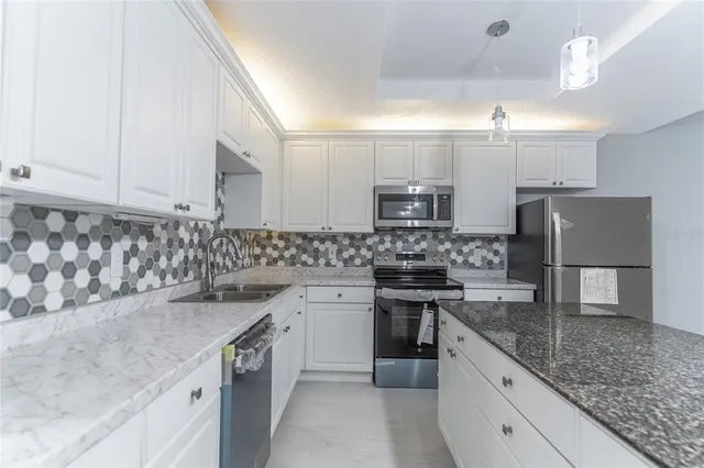 a view of a kitchen with refrigerator and microwave