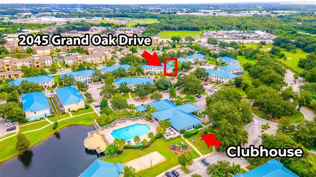 a view of a hallway with entryway and stairs