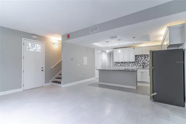 a kitchen with stainless steel appliances granite countertop a sink stove cabinets and granite counter tops