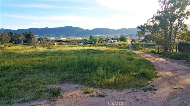 a view of a town with mountains in the background