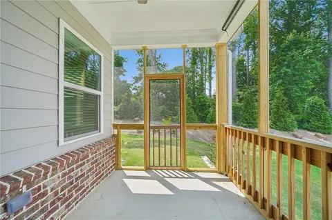 a view of a porch with wooden floor and outdoor space