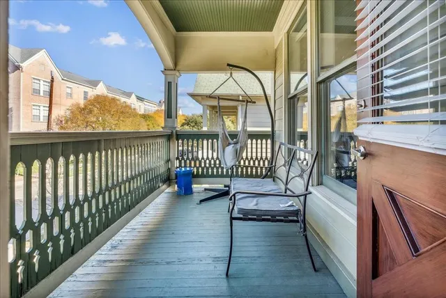 a view of a balcony with chairs