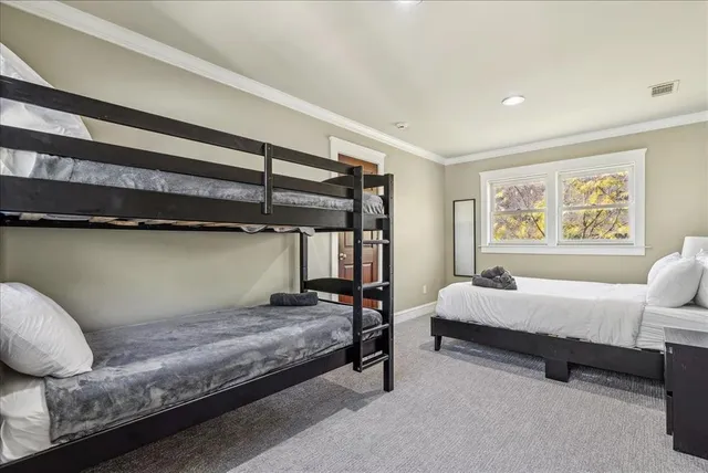 a bedroom with bed and window