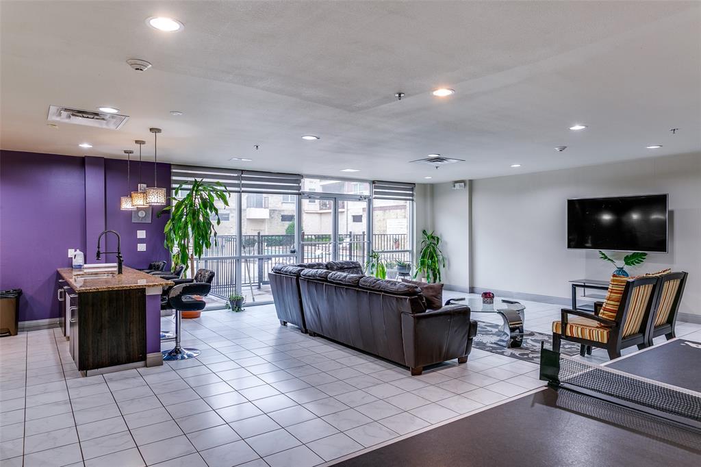 1100 West Trinity Mills Road, Unit 3005 Carrollton, TX 75006 - Photo 13 of 15 a living room with furniture a flat screen tv and floor to ceiling window