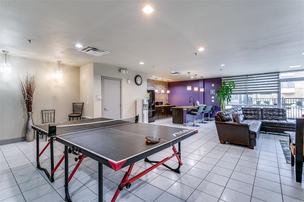 1100 West Trinity Mills Road, Unit 3005 Carrollton, TX 75006 - Photo 14 of 15 a kitchen with a dining table chairs and a counter top space