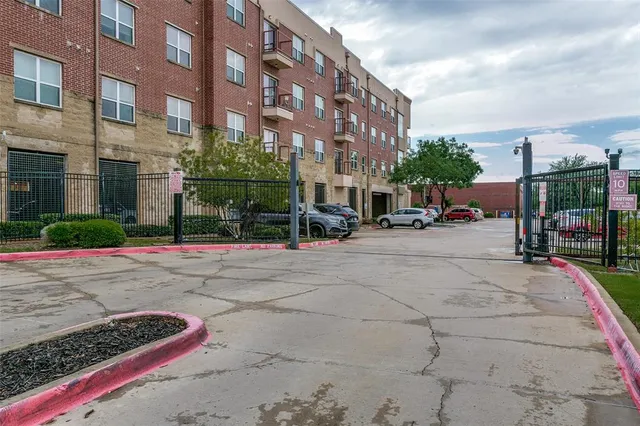 a city street lined with buildings and cars