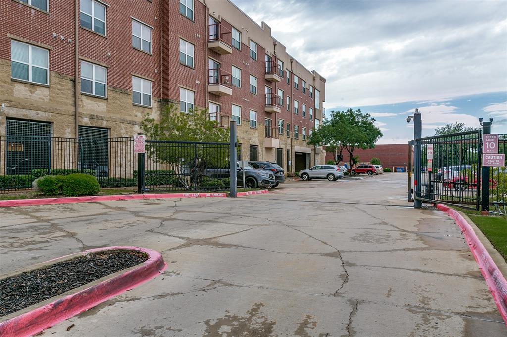 1100 West Trinity Mills Road, Unit 3005 Carrollton, TX 75006 - Photo 2 of 15 a city street lined with buildings and cars