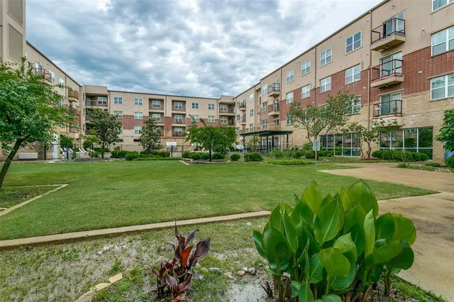 a front view of building with yard and green space