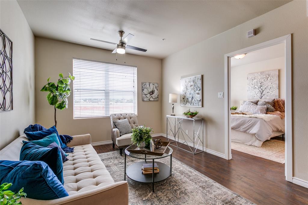 1100 West Trinity Mills Road, Unit 3005 Carrollton, TX 75006 - Photo 9 of 15 a living room with furniture and a potted plant