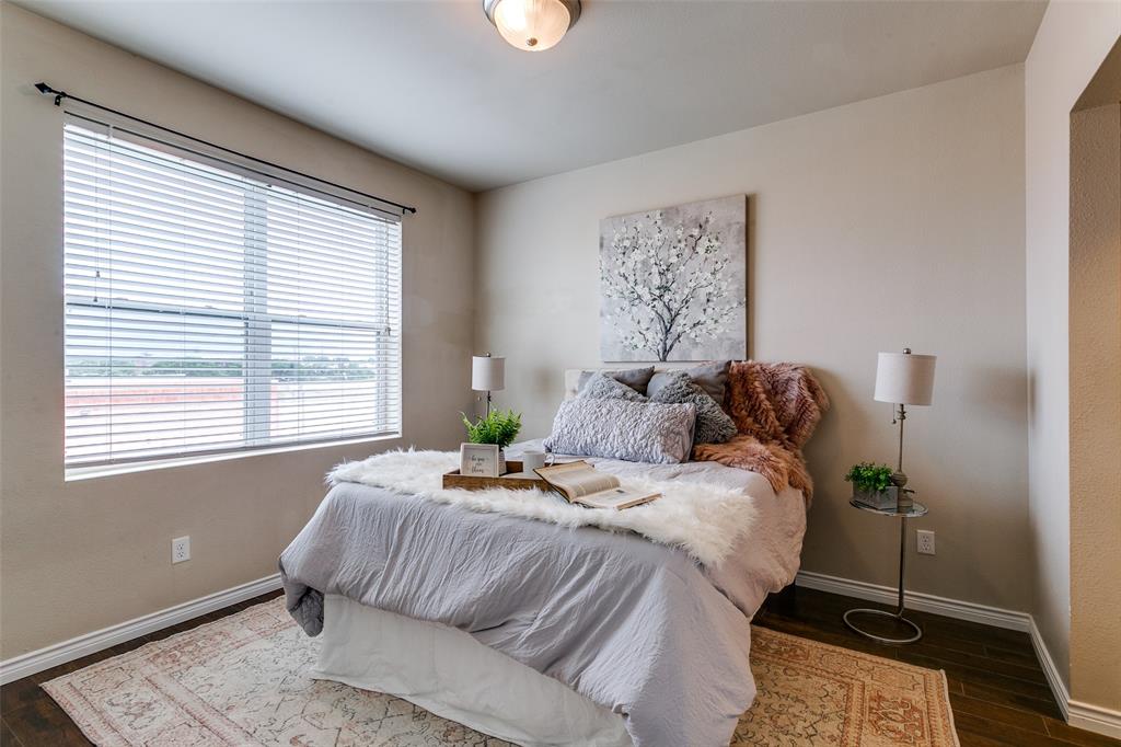 1100 West Trinity Mills Road, Unit 3005 Carrollton, TX 75006 - Photo 10 of 15 a bedroom with a bed and window