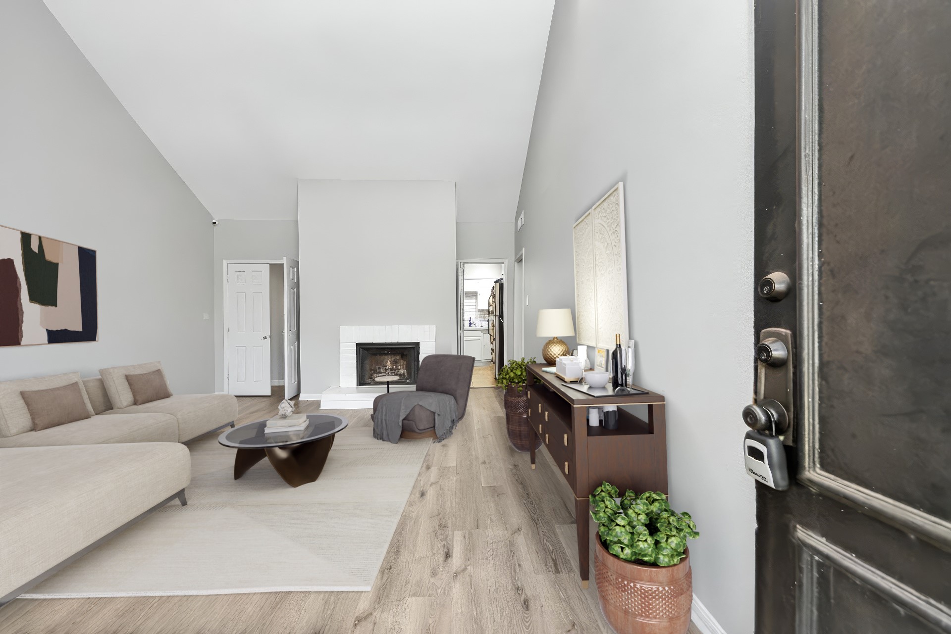 a living room with furniture fireplace and a potted plant