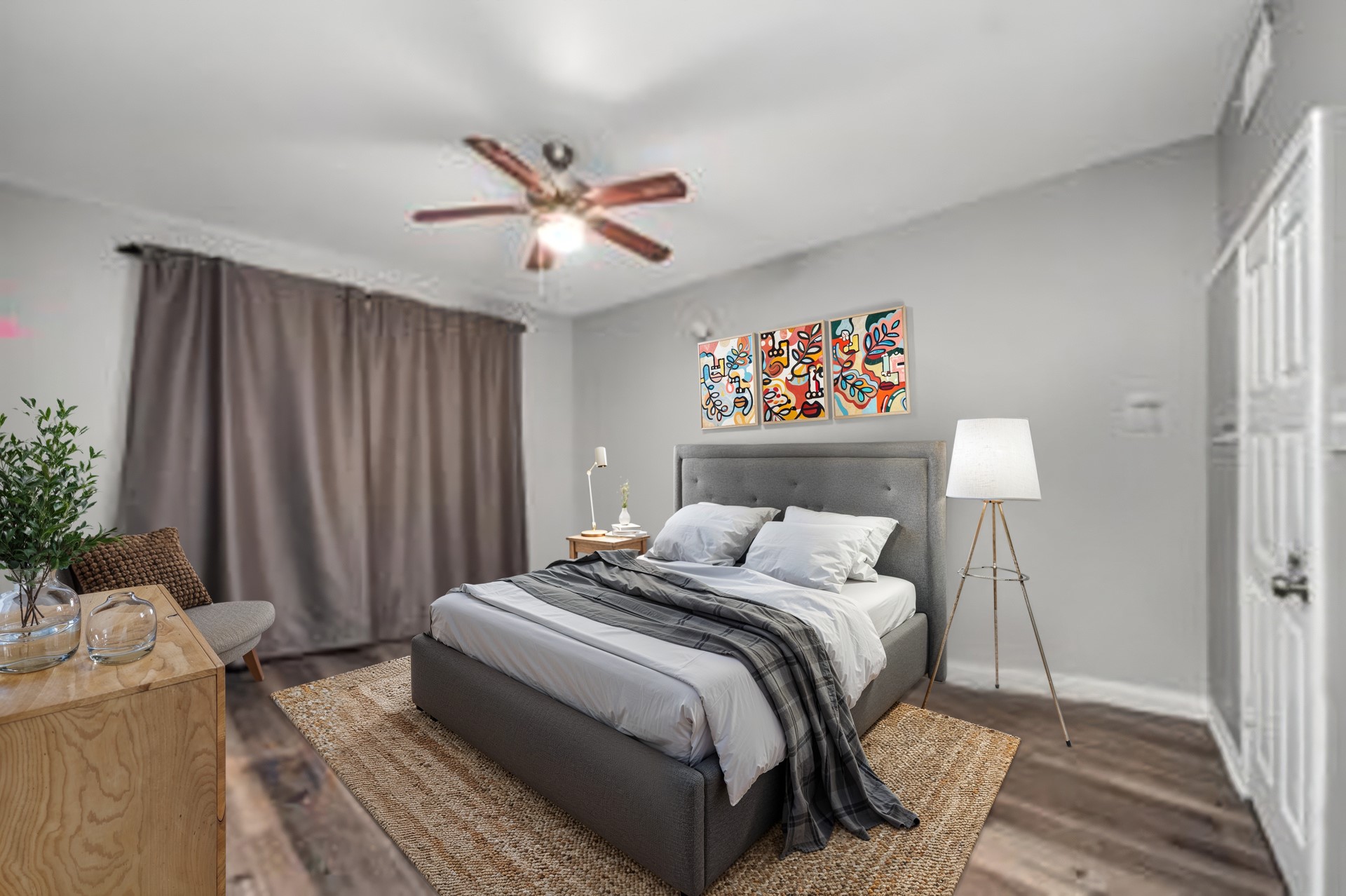 2100 Tanglewilde Street, Unit 312 Houston, TX 77063 - Photo 5 of 11 a bedroom with a bed and a chandelier