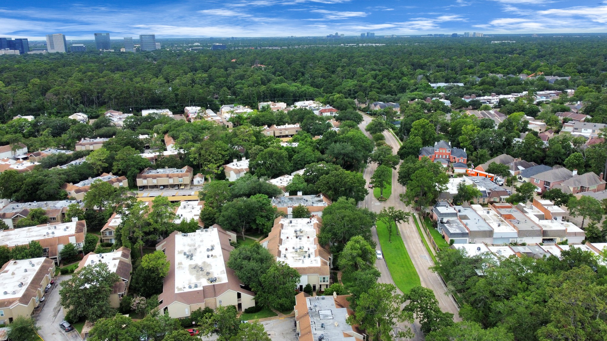 2100 Tanglewilde Street, Unit 312 Houston, TX 77063 - Photo 6 of 11 an aerial view of residential houses with outdoor space and trees