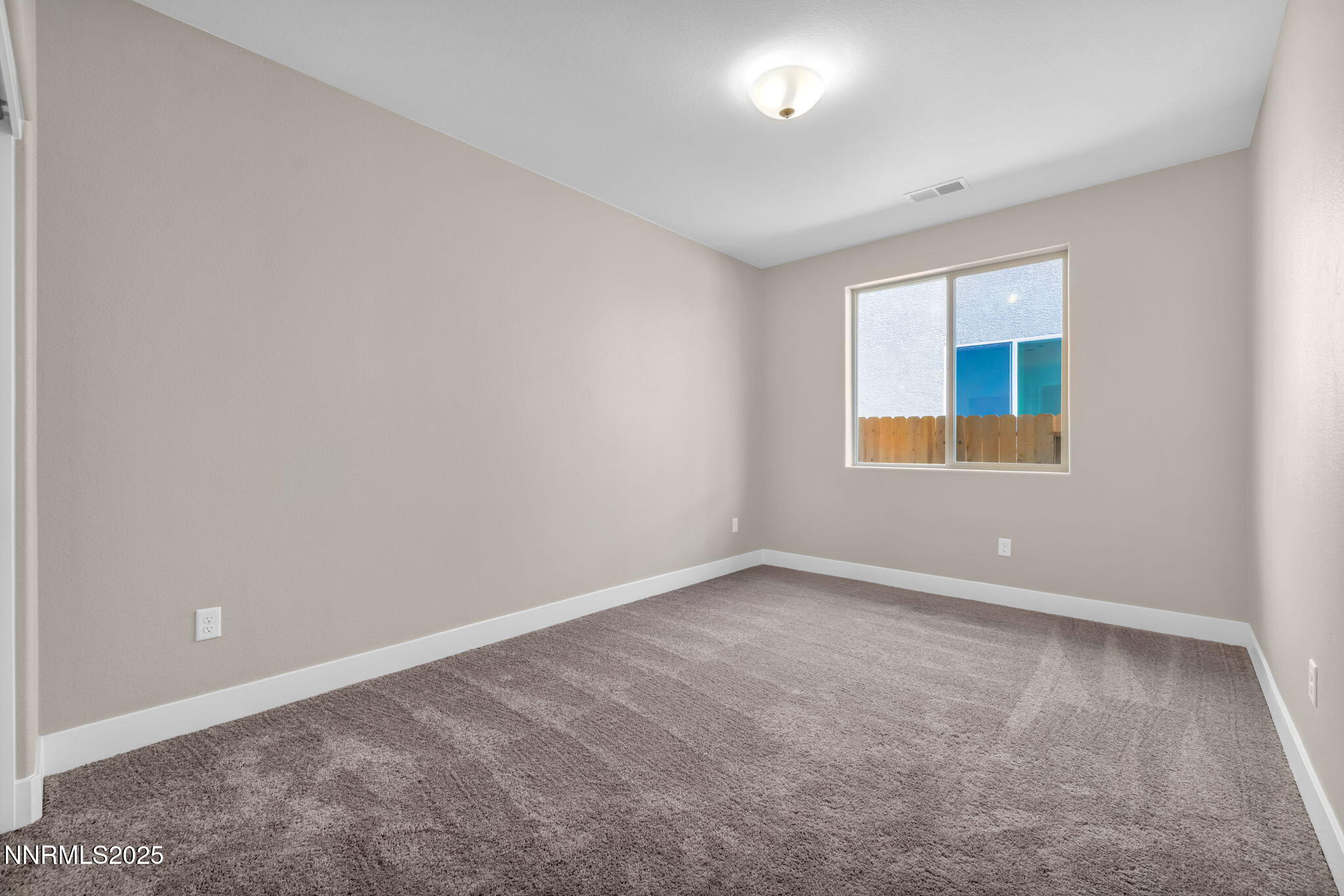 1334 Nebula Road, Unit HOMESITE 94 Carson City, NV 89705 - Photo 16 of 22 an empty room with a window