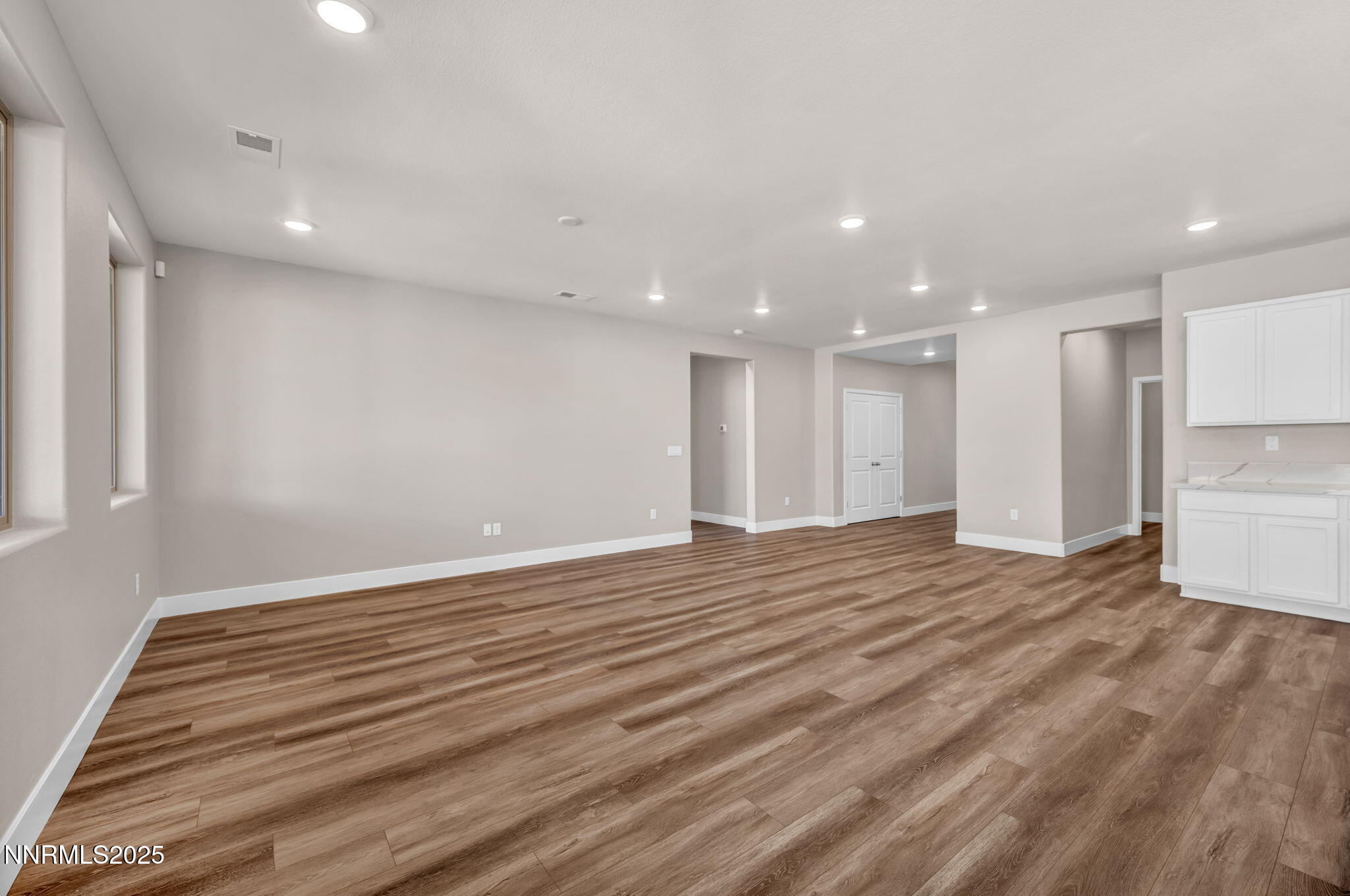 1334 Nebula Road, Unit HOMESITE 94 Carson City, NV 89705 - Photo 7 of 22 a view of an empty room with wooden floor and a window