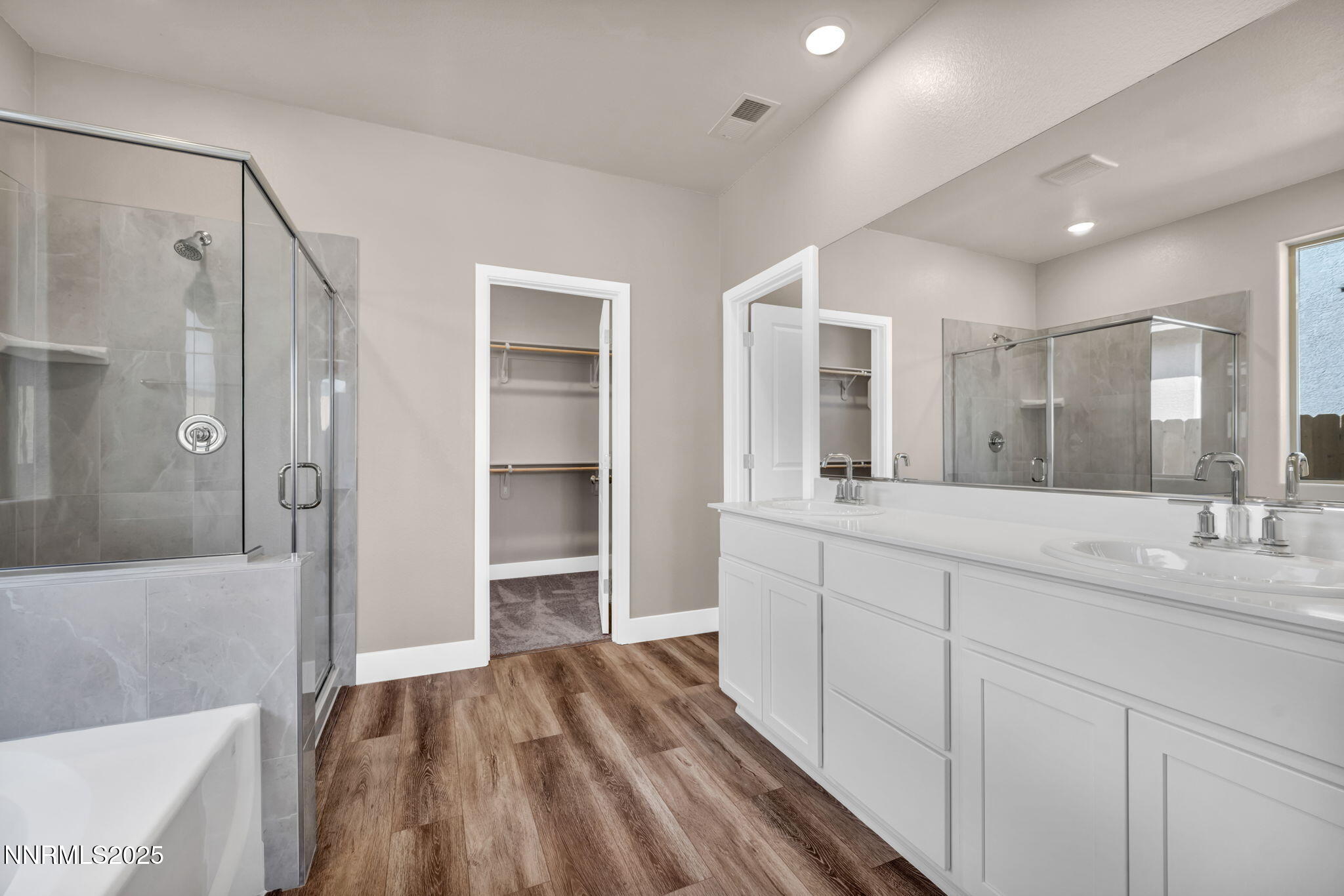 1334 Nebula Road, Unit HOMESITE 94 Carson City, NV 89705 - Photo 10 of 22 a spacious bathroom with a shower sink and mirror