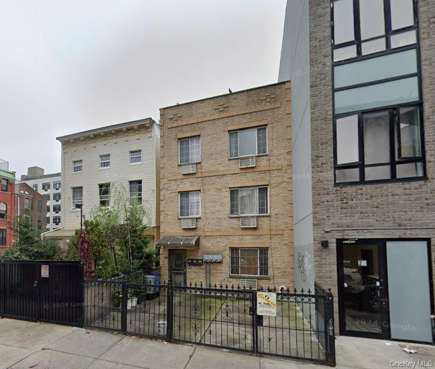 22 Jefferson Street, Unit 3 Brooklyn, NY 11206 - Photo 12 of 12 a front view of a building with balcony