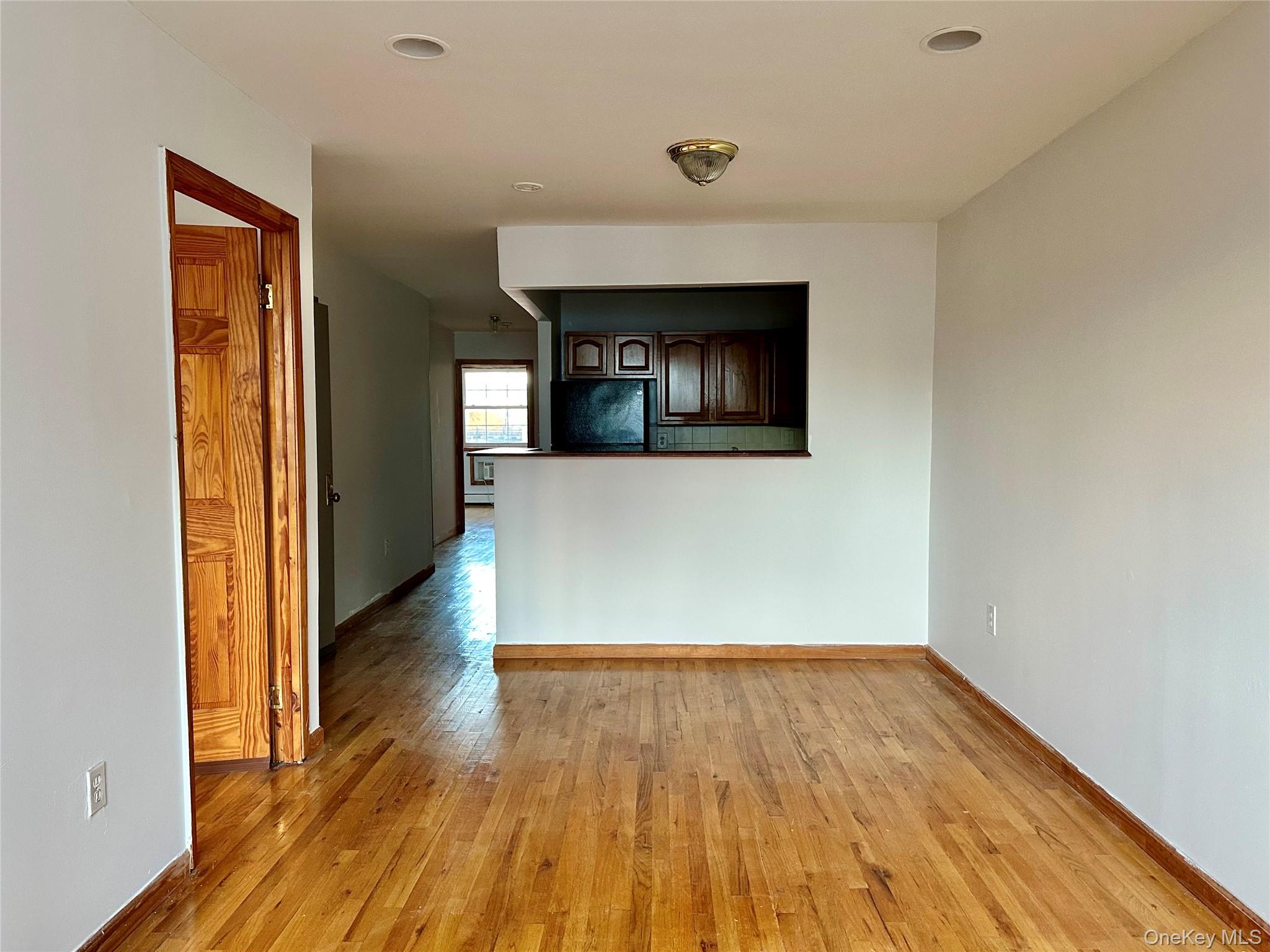 22 Jefferson Street, Unit 3 Brooklyn, NY 11206 - Photo 2 of 12 a view of a livingroom with wooden floor
