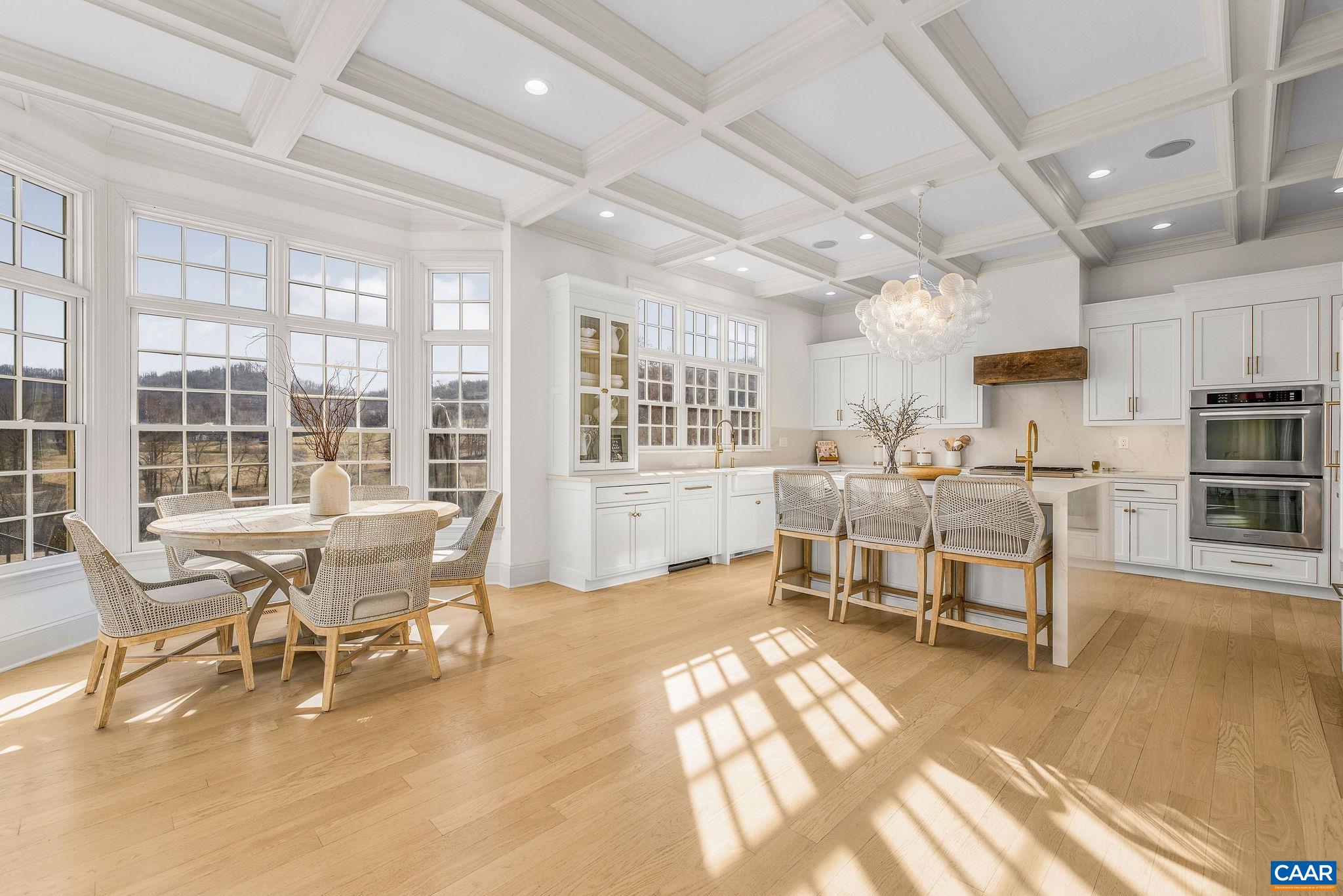 0 Ragged Mountain Drive Charlottesville, VA 22903 - Photo 21 of 70 a living room with lots of furniture a dining table and chairs with wooden floor