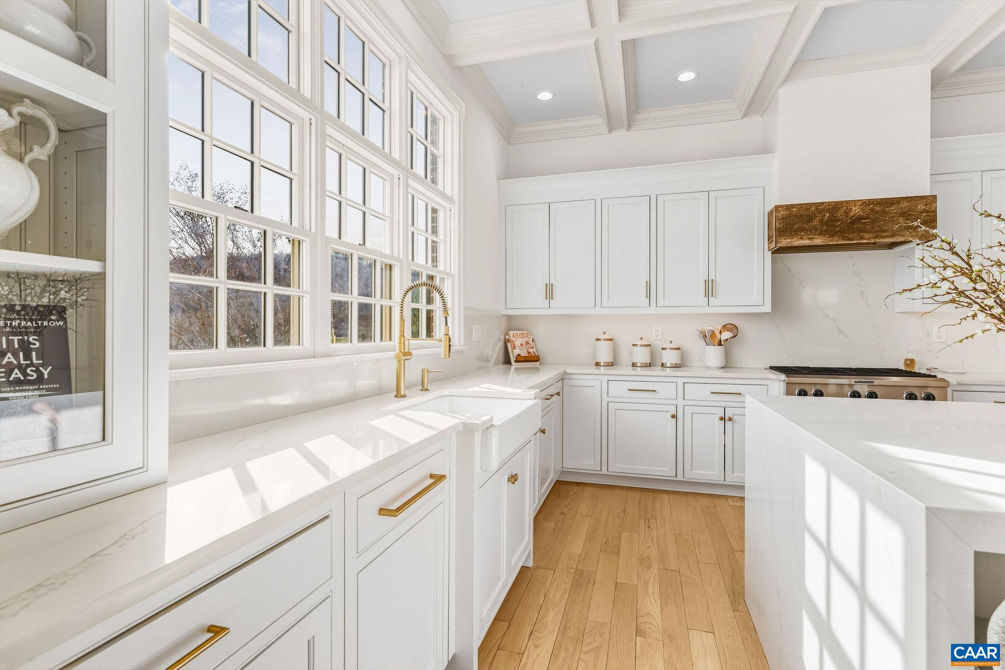 0 Ragged Mountain Drive Charlottesville, VA 22903 - Photo 26 of 70 a kitchen that has a lot of white cabinets and wooden floor