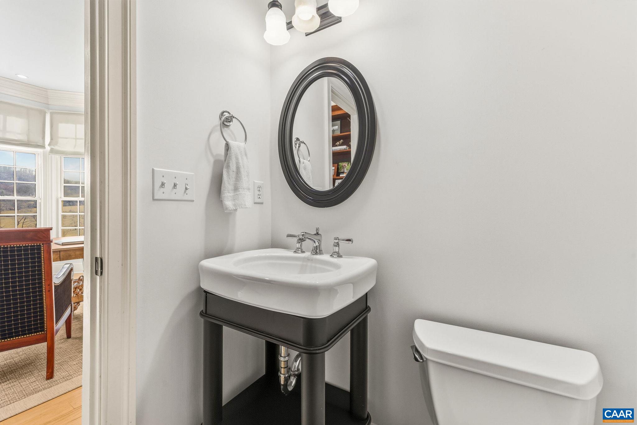 0 Ragged Mountain Drive Charlottesville, VA 22903 - Photo 34 of 70 a bathroom with a toilet a sink and a mirror
