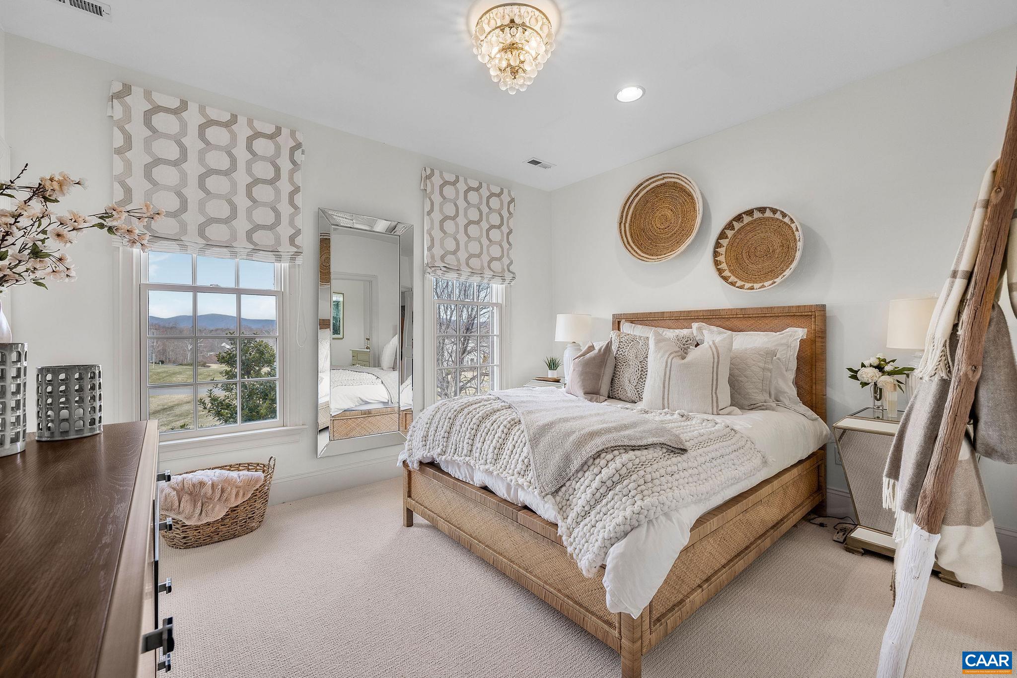 0 Ragged Mountain Drive Charlottesville, VA 22903 - Photo 48 of 70 a spacious bedroom with a bed couch and a window