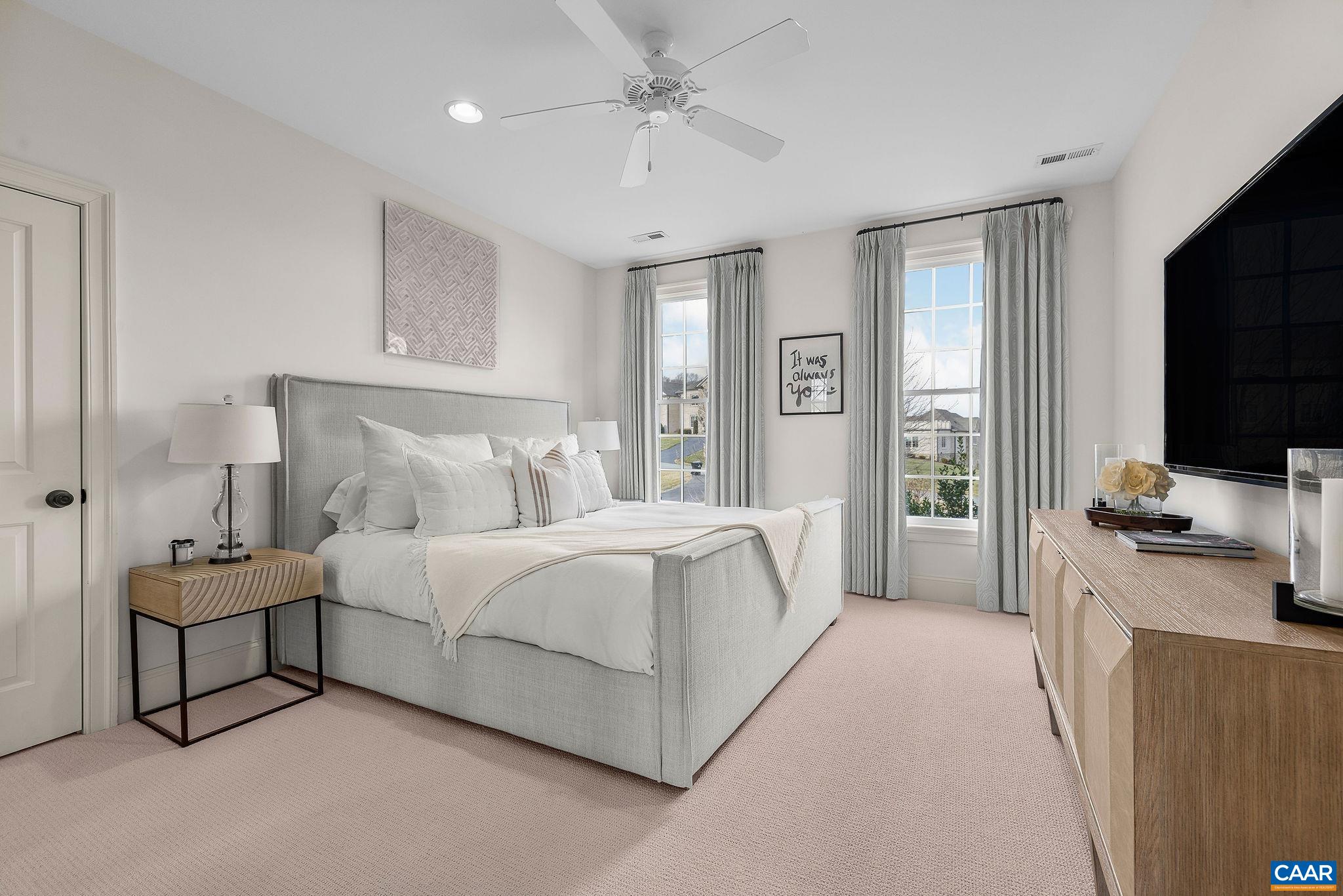 0 Ragged Mountain Drive Charlottesville, VA 22903 - Photo 53 of 70 a spacious bedroom with a bed and a flat screen tv