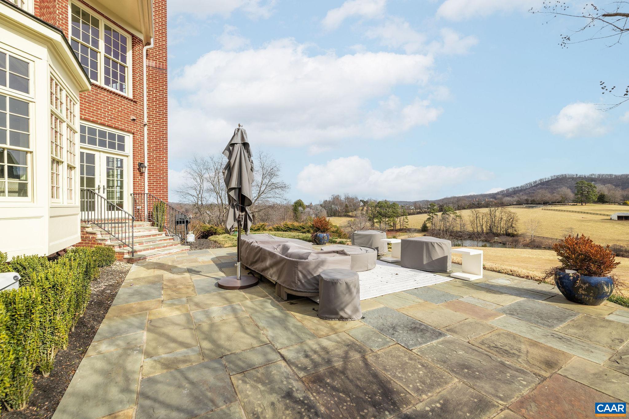 0 Ragged Mountain Drive Charlottesville, VA 22903 - Photo 58 of 70 a view of a terrace with couches and lounge chairs