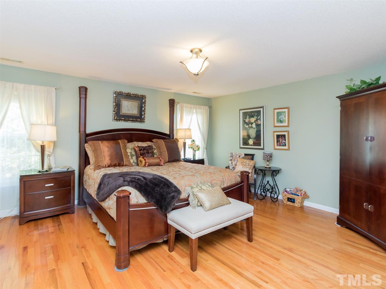2500 Bulmer Terrace Raleigh, NC 27615 - Photo 11 of 25 a bedroom with a bed and a dresser