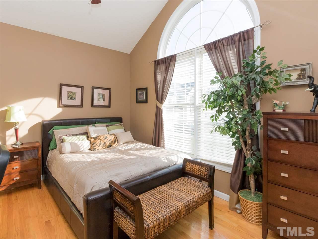 2500 Bulmer Terrace Raleigh, NC 27615 - Photo 14 of 25 a bedroom with a bed and a potted plant