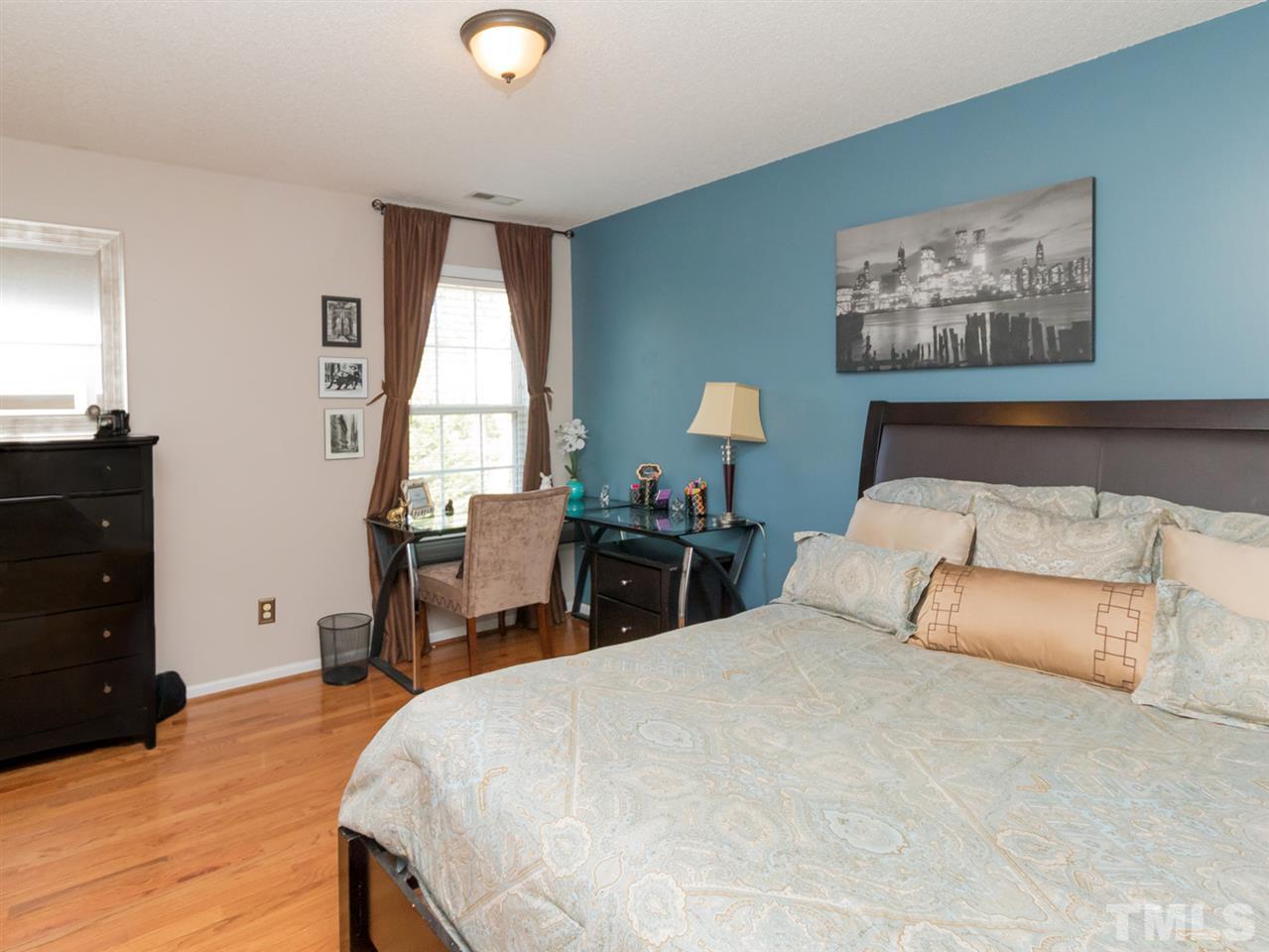 2500 Bulmer Terrace Raleigh, NC 27615 - Photo 15 of 25 a bedroom with a bed and a dresser