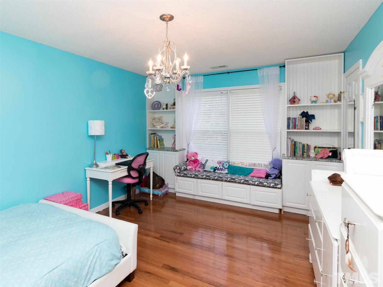 2500 Bulmer Terrace Raleigh, NC 27615 - Photo 16 of 25 a bedroom with furniture and a chandelier